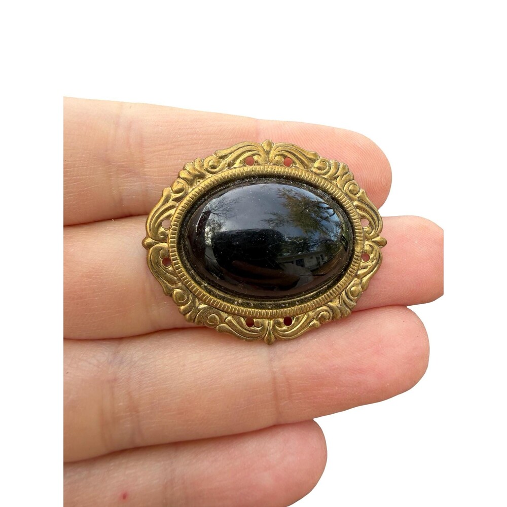 Victorian brooch with black stone black and gold tone pin